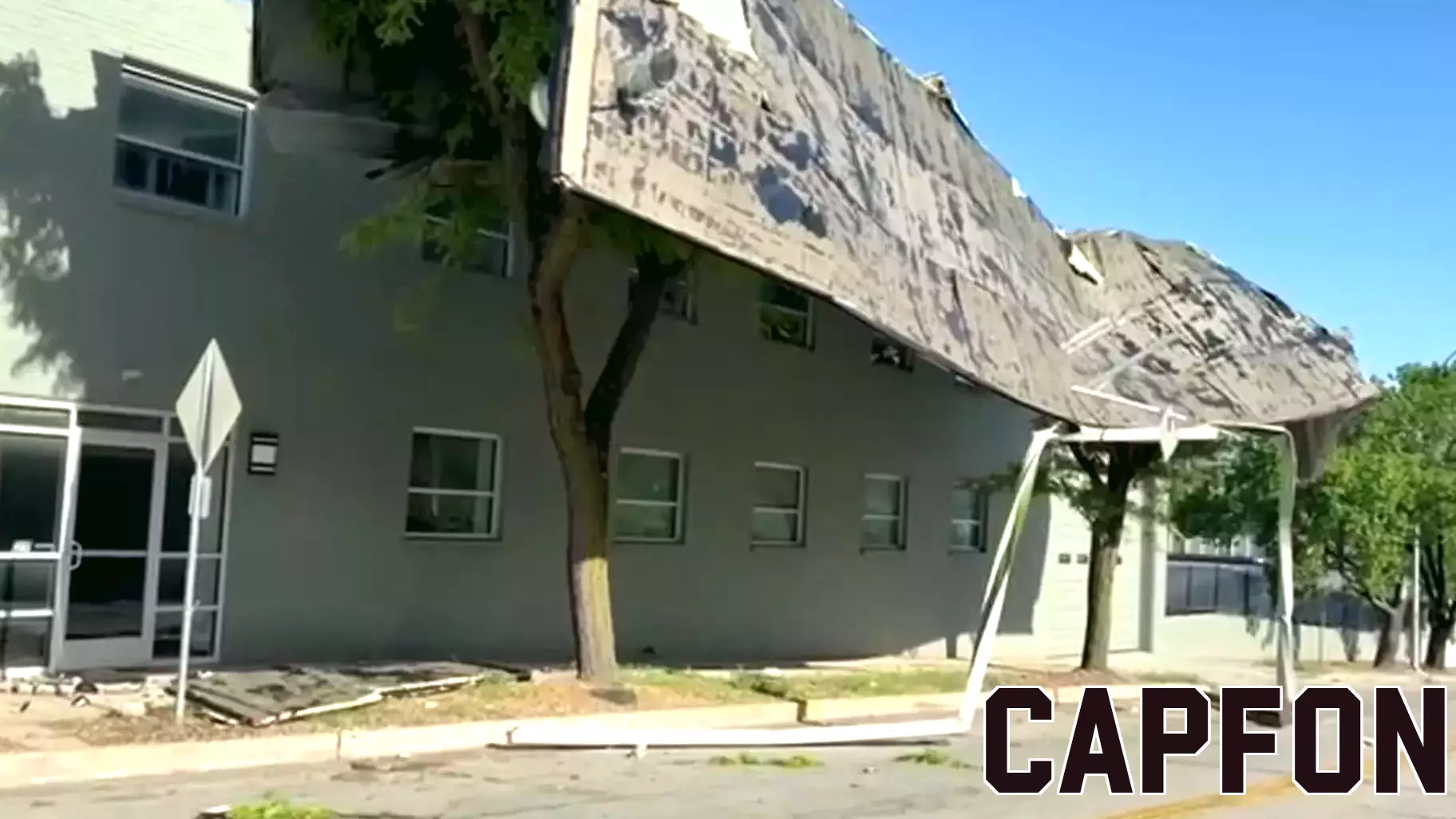 RAW: MO: STORMS BLOW ROOF OFF BUSINESS, LANDS ON TREE